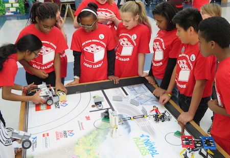 Student Competitors around an FLL tournament table